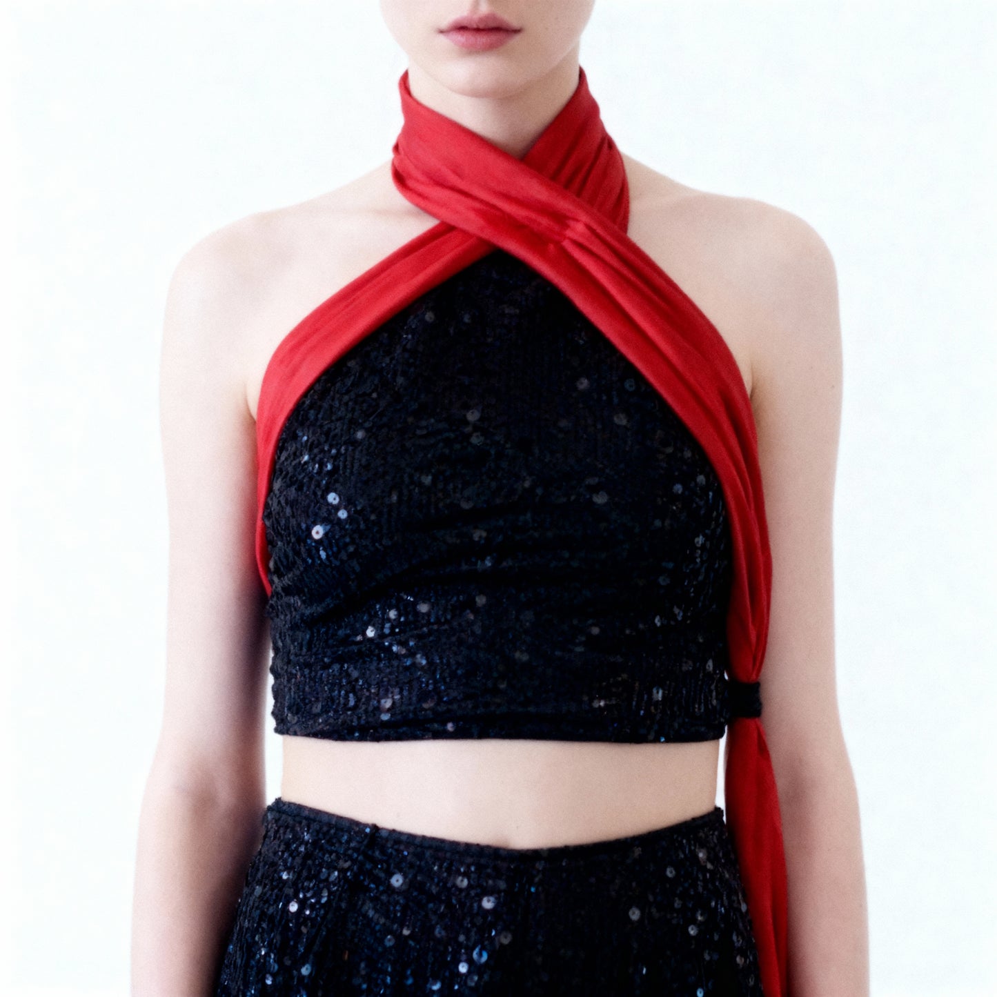 Ammeline Sequined Flared Trousers styled for an evening event, emphasizing the flattering flared cut and luxurious materials.