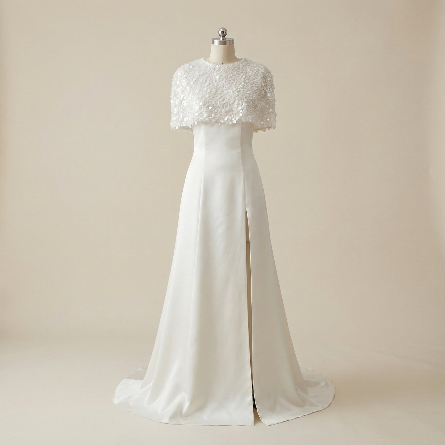 The captivating front slit of the Eve Couture London Daneriss Wedding Set with Sequined Cape, highlighting the seductive yet classy design of this embellished bridal gown, perfect for the modern bride's bridal collection.