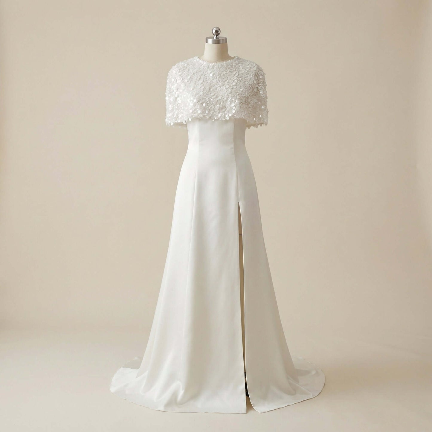 The captivating front slit of the Eve Couture London Daneriss Wedding Set with Sequined Cape, highlighting the seductive yet classy design of this embellished bridal gown, perfect for the modern bride's bridal collection.