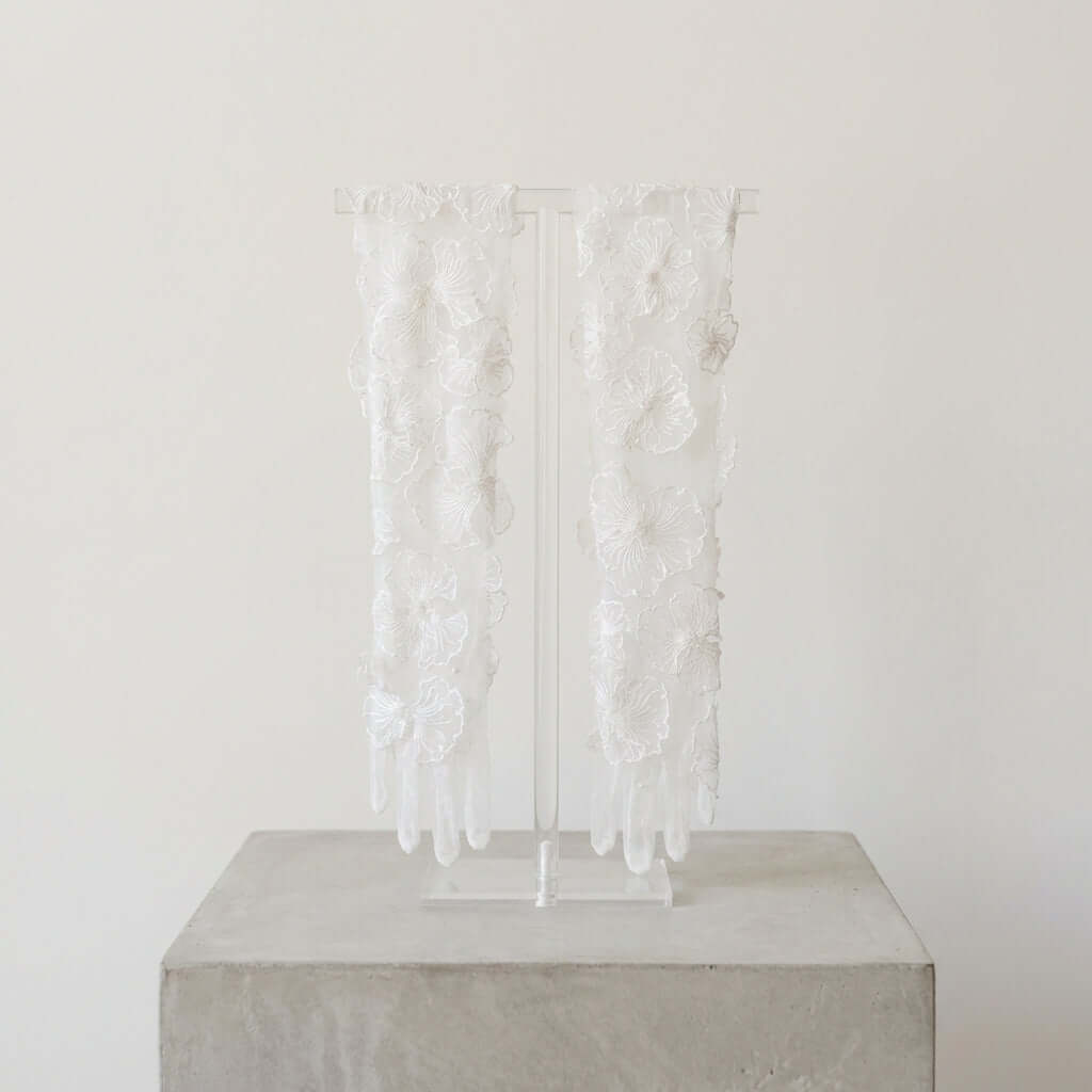 Delicate Myriss Bridal Gloves from Eve Couture, ideal for brides seeking a couture touch. These luxurious hand made gloves enhance any bridal ensemble with a designer flair befitting of a London fashion statement.